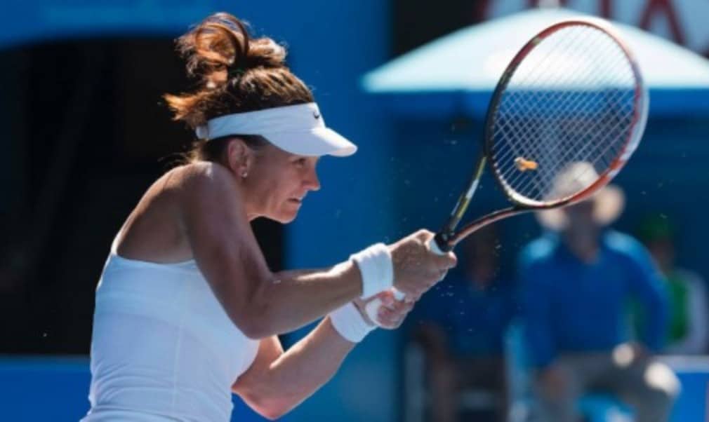 Casey DellacquaÈs run at the Australian Open continued as she reached the fourth round of a Grand Slam for the first time since 2008