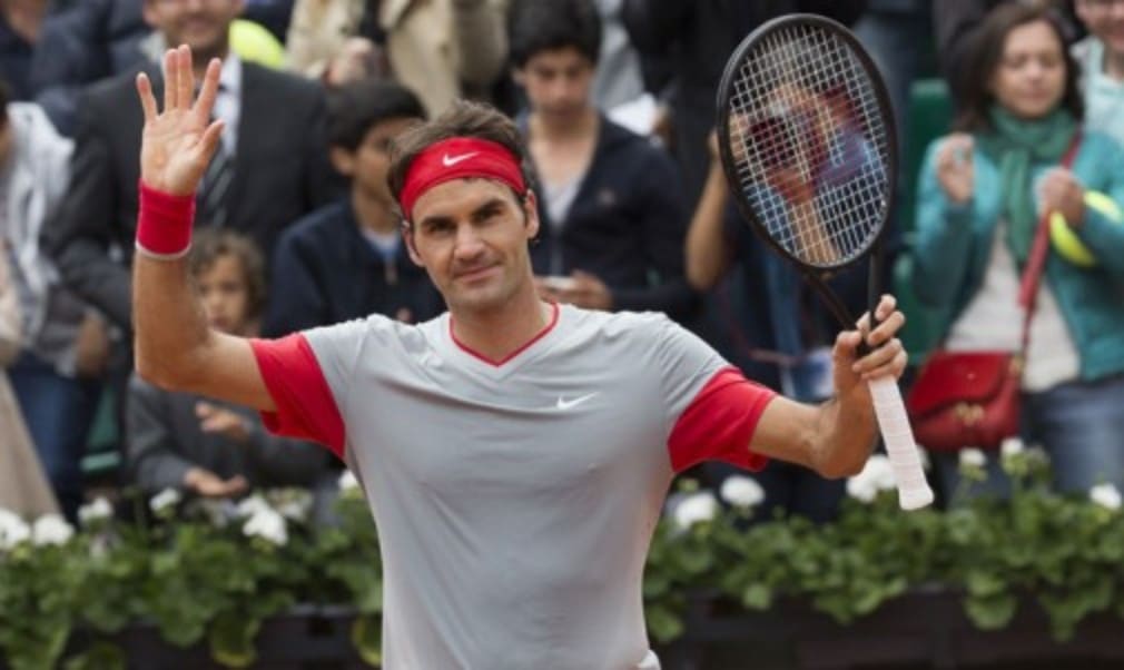 Roger Federer surpassed Guillermo Vilas's record of 11 appearances in the last 16 at Roland Garros following a hard-fought 7-5 6-7(7) 6-2 6-4 win over Dmitry Tursnov