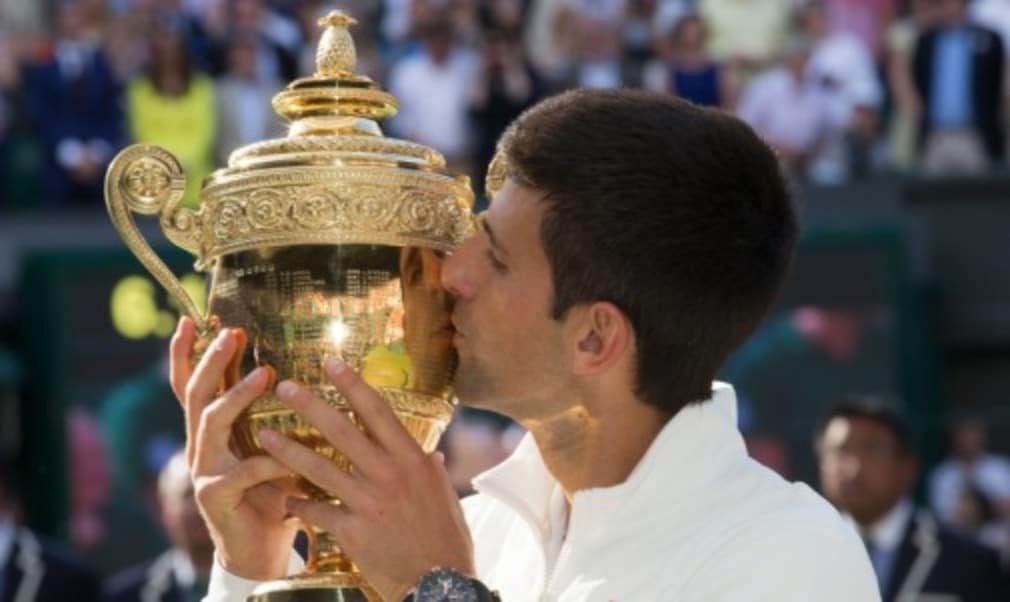 Novak Djokovic displayed tremendous spirit to hold off a fierce fightback from Roger Federer and claim his second Wimbledon title