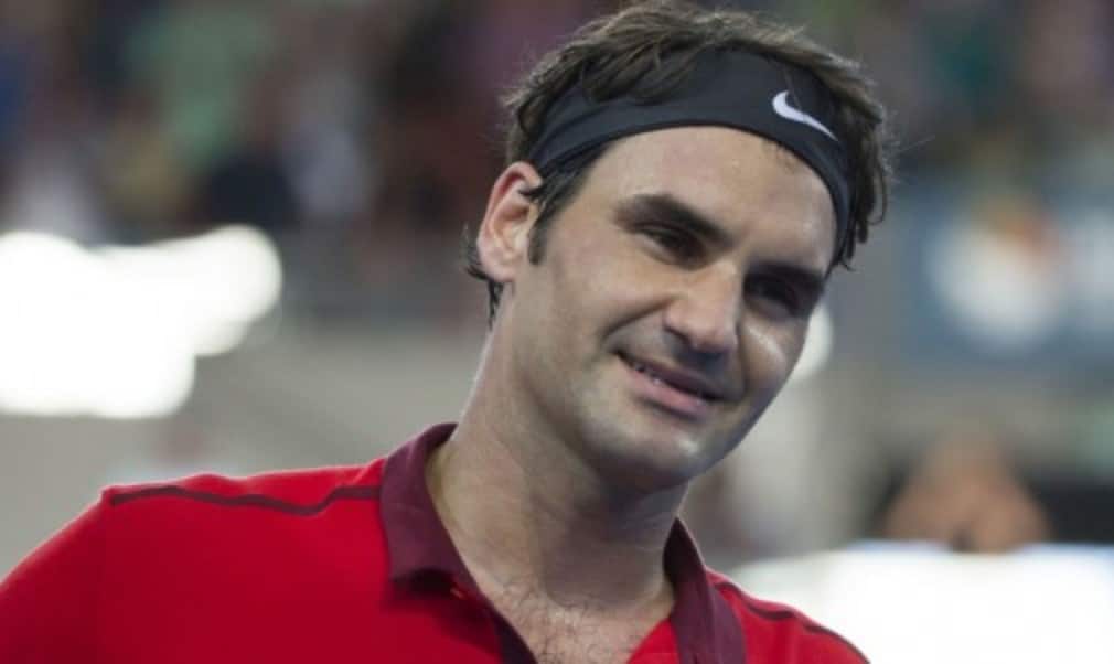 Roger Federer and Caroline Wozniacki were honoured by tennis writers for their contributions in 2014
