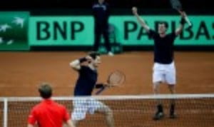 Andy and Jamie Murray defeated David Goffin and Steve Darcis 6-4 4-6 6-3 6-2 to give GB a 2-1 lead heading into SundayÈs reverse singles