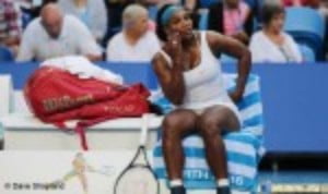 Serena Williams retired from her singles match at the Hopman Cup on Tuesday with a knee injury