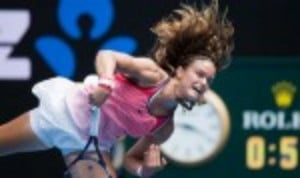 That's a lot of hair! World No.170 Maria Sakkari serves during her 6-7(5) 6-2 6-2 defeat to Carla Suarez Navarro