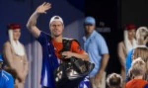 Lleyton Hewitt bade an emotional farewell to tennis as he bowed out following his final professional singles match at the Australian Open