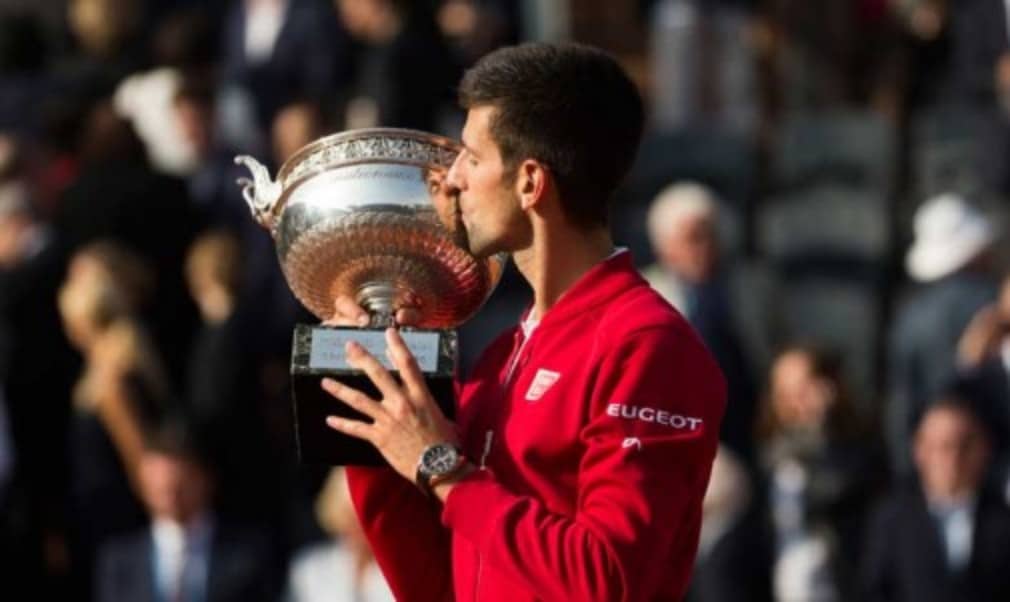 Novak Djokovic sealed his place in the history books as he defeated Andy Murray at Roland Garros to capture his career Grand Slam