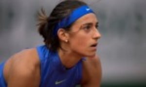 Caroline Garcia maintained her hopes of qualifying for the WTA Finals in Singapore by producing a stirring fight back to shock Elina Svitolina at the China Open in Beijing