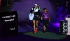 Caroline Wozniacki eased into the semi-finals of the BNP Paribas WTA Finals in Singapore after a thumping 6-0 6-2 win over Simona Halep in the Red Group