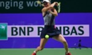 Caroline Wozniacki overcame Venus Williams 6-4 6-4 to capture the biggest title of her 12-year career at the BNP Paribas WTA Finals in Singapore