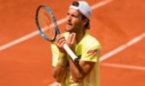 Joao SousaÈs bid to become the first Portuguese winner of the Estoril Open remains on track after a topsy-turvy 6-3 1-6 6-0 win over Kyle Edmund