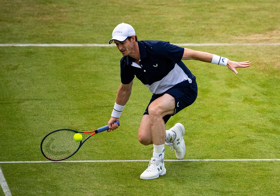 Andy Murray stooping for shot at Queen's