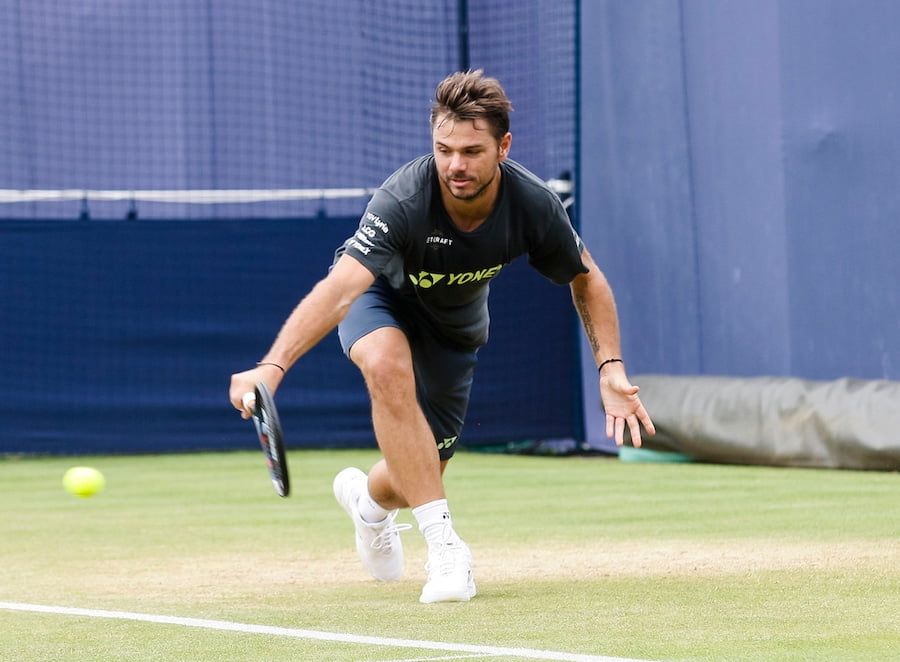 Wawrinka hits a backhand on grass