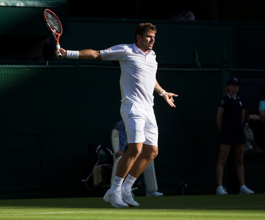 Stan Wawrinka hits backhand on grass at Wimbledon