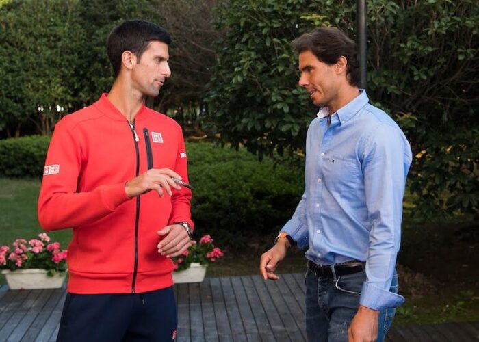 Novak Djokovic chats with Rafael Nadal off court