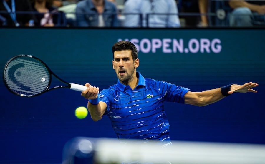 Novak Djokovic hits forehand at US Open 2019
