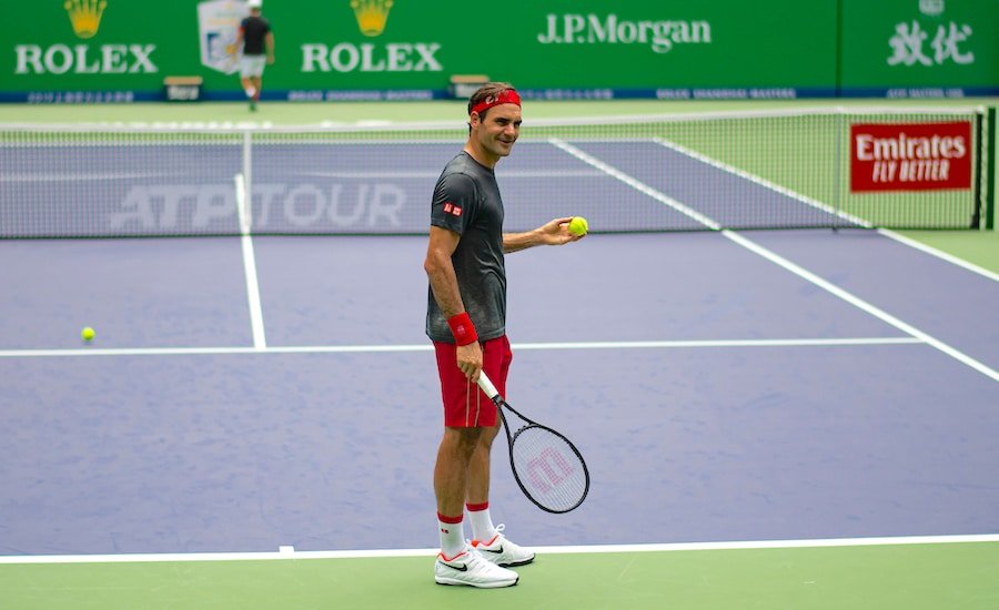 Roger Federer laughs in practise at Shanghai 2019