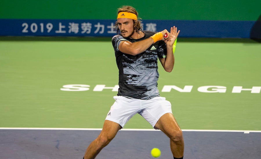 Stefanos Tsitsipas concentrates on a forehand at Shanghai Masters 2019