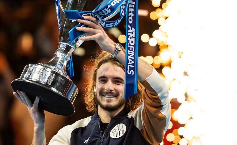 Stefanos Tsitsipas holds aloft ATP Finals 2019 trophy