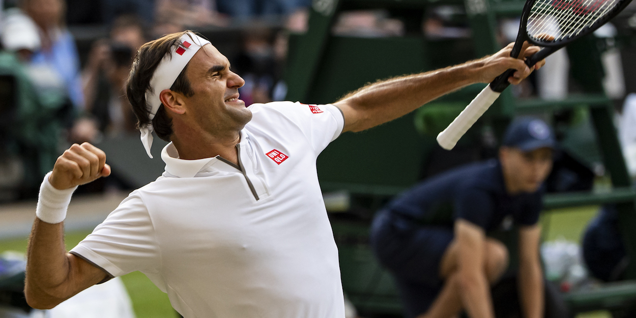 Roger Federer punches the air at Wimbledon