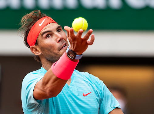 Rafa Nadal hits a serve at Roland Garros 2020