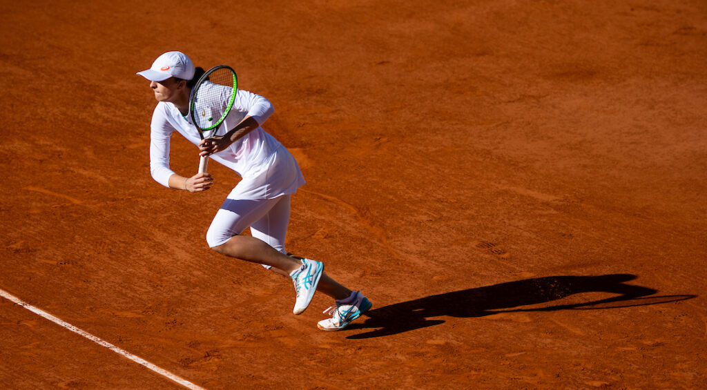 Iga Swiatek sprints for a ball during the French Open 2020