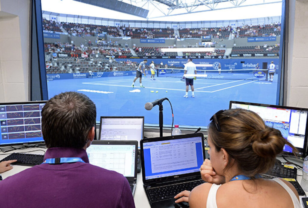 Hawk-Eye officials monitor the system from a courtside-booth